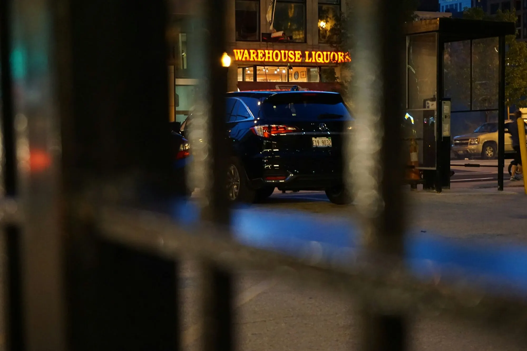 Lead chauffeur on duty, black SUV at the night entrance of a hotel