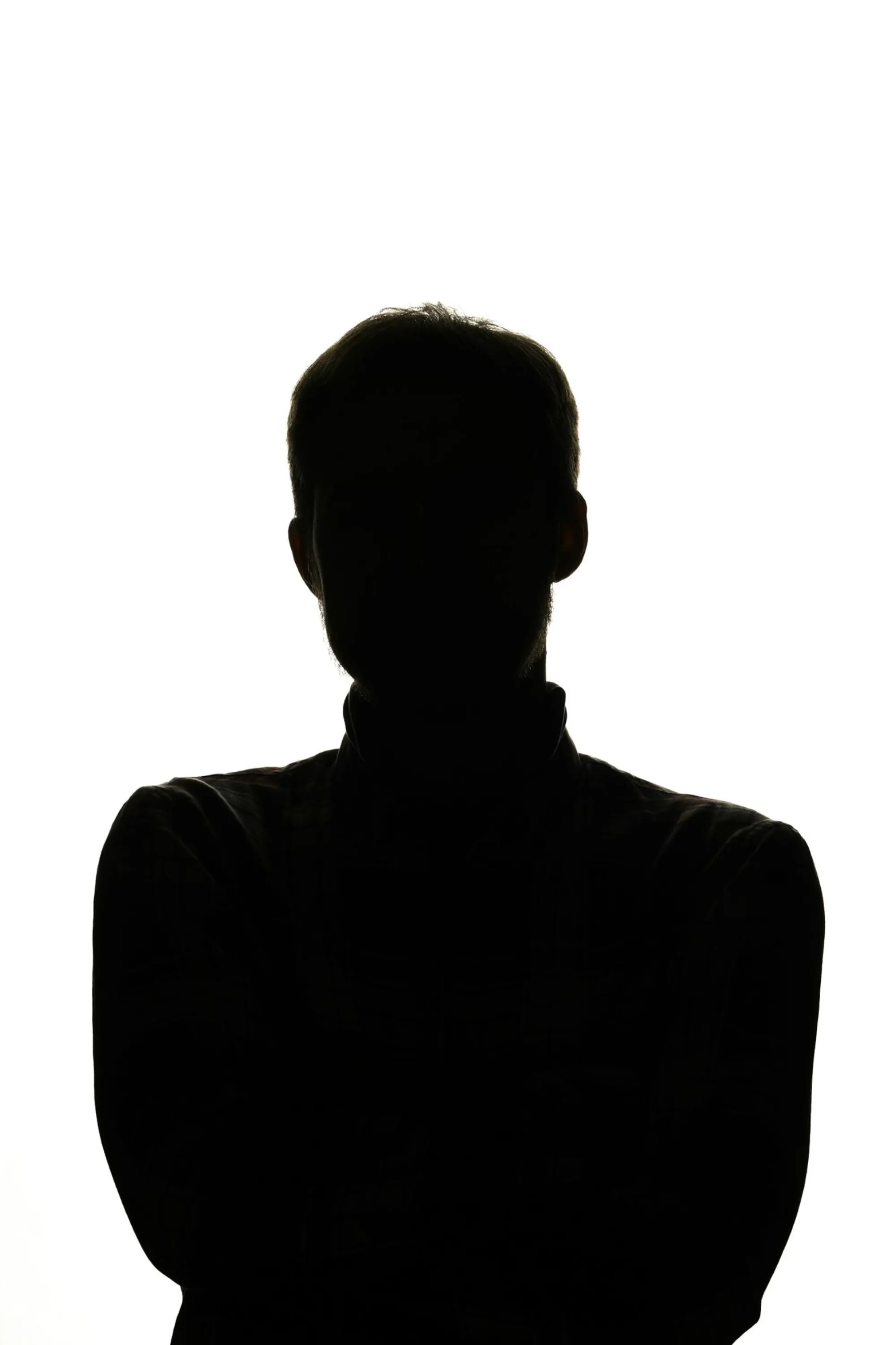 Lead protective agent in motion, dusk arrival, suited silhouette
