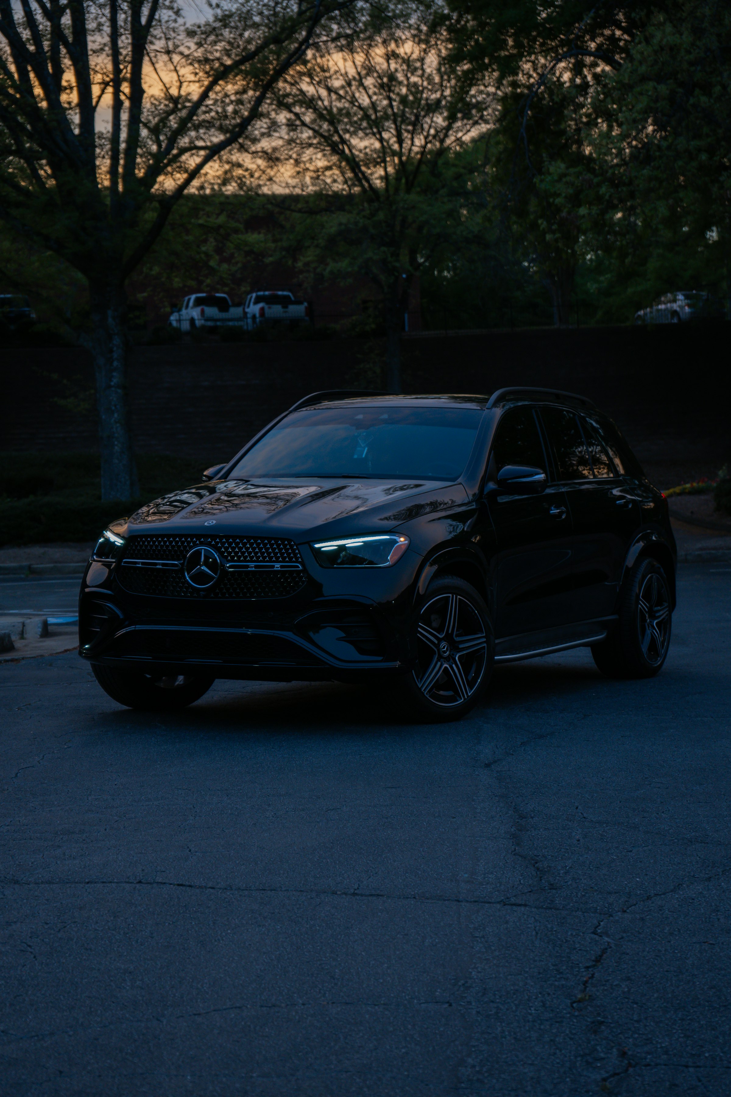 Black executive vehicle, dusk